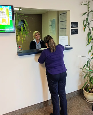 Woman at reception desk