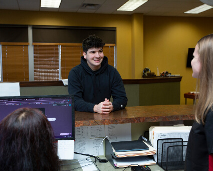 man checking at front desk