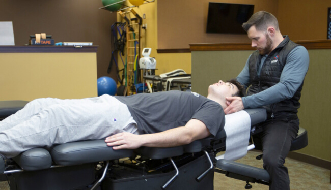 Midwest Sport and Spine Chiropractor Dr. Josh adjusting man's neck