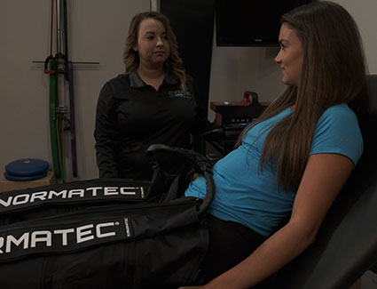 Woman with Normatec on legs