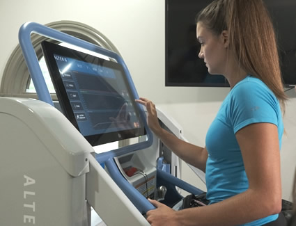 Woman using treadmill