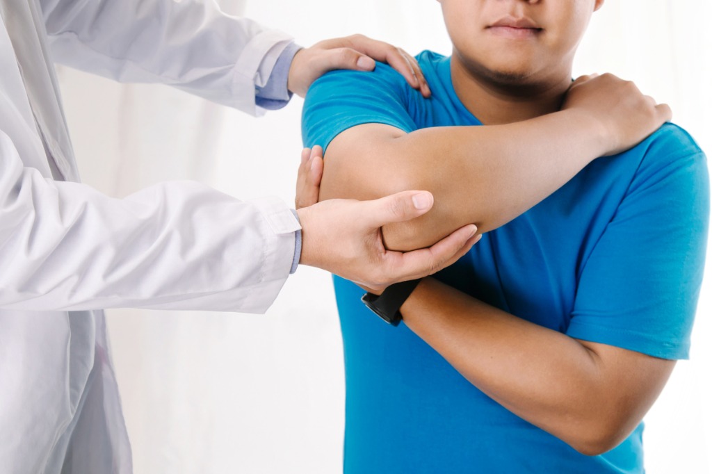 chiropractor-working-on-elbow-and-shoulder