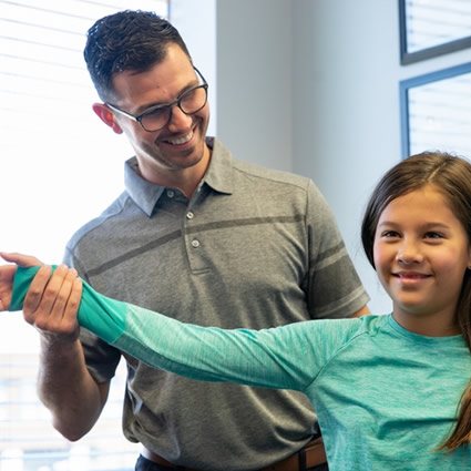 Dr. Harlan with girl patient