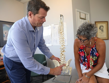 Dr. Sandwell talking to patient about spine