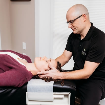 Woman getting neck adjustment