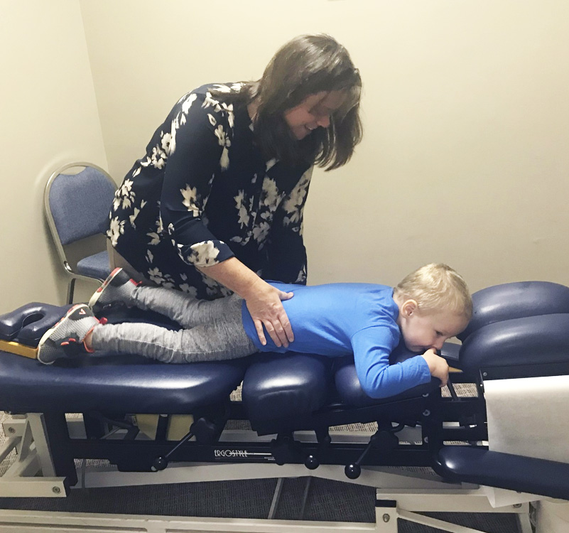 Dr. Wendy adjusting child
