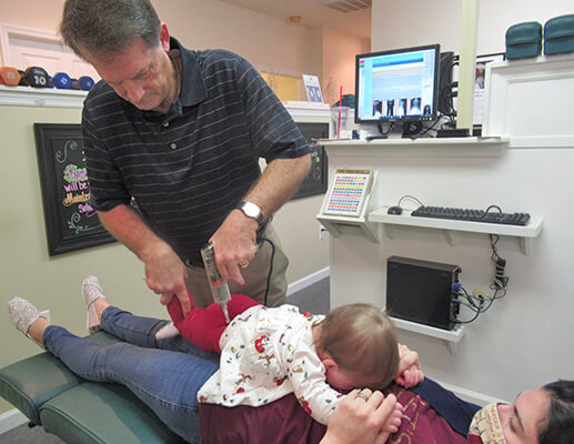 Dr. McKelvey treating baby