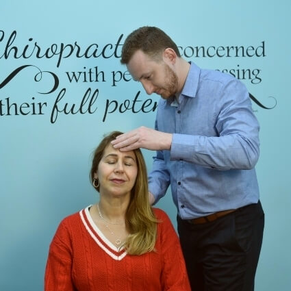 Dr Cooper adjusting woman