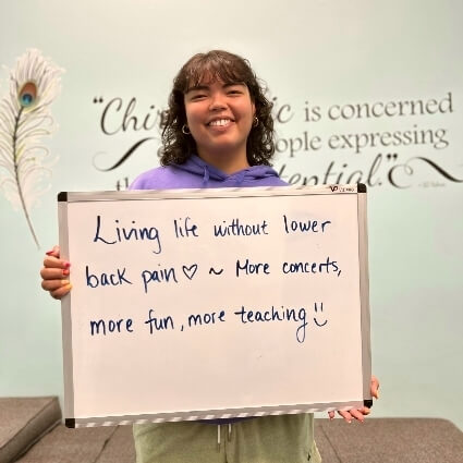 person holding white board