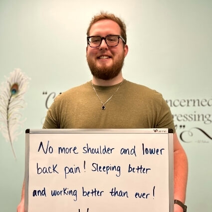 person holding white board