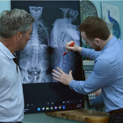 Dr Cooper reviewing patient xrays