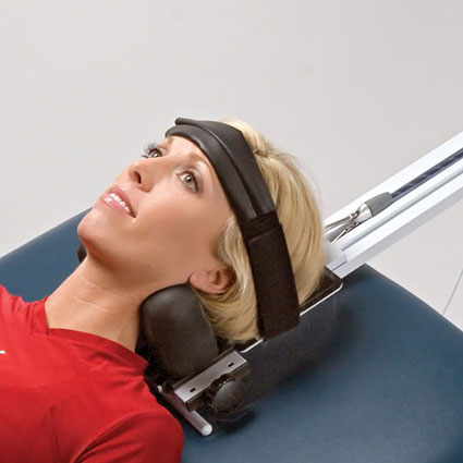 Woman getting decompression on neck