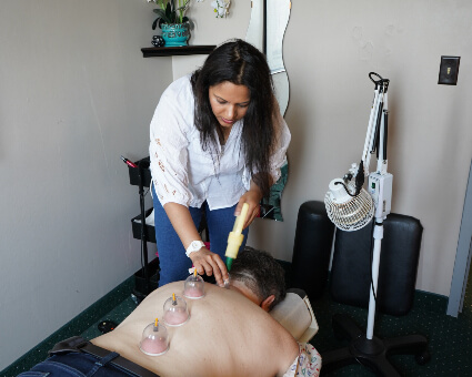 St Paul patient being treated with Cupping and Fire Cupping Therapy