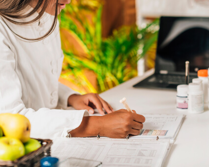 Functional Medicine practitioner sitting at desk