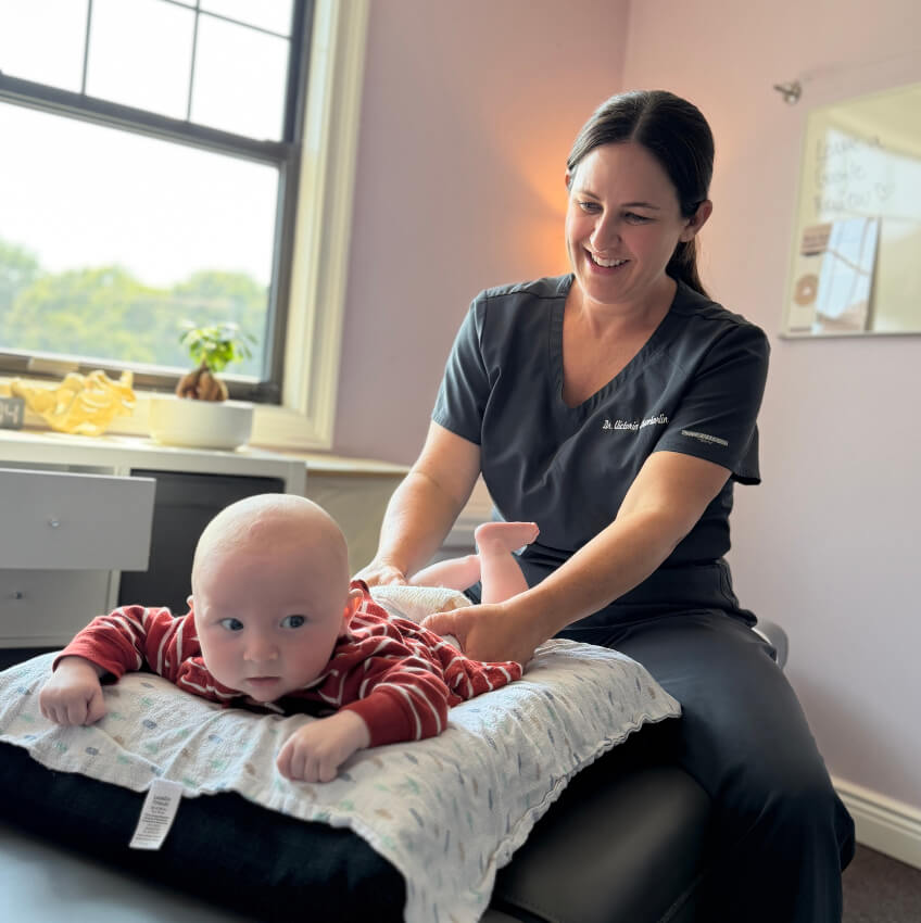 baby having back examined