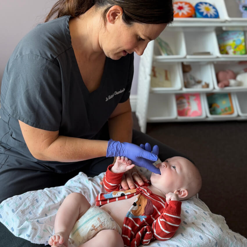 baby having tongue examined