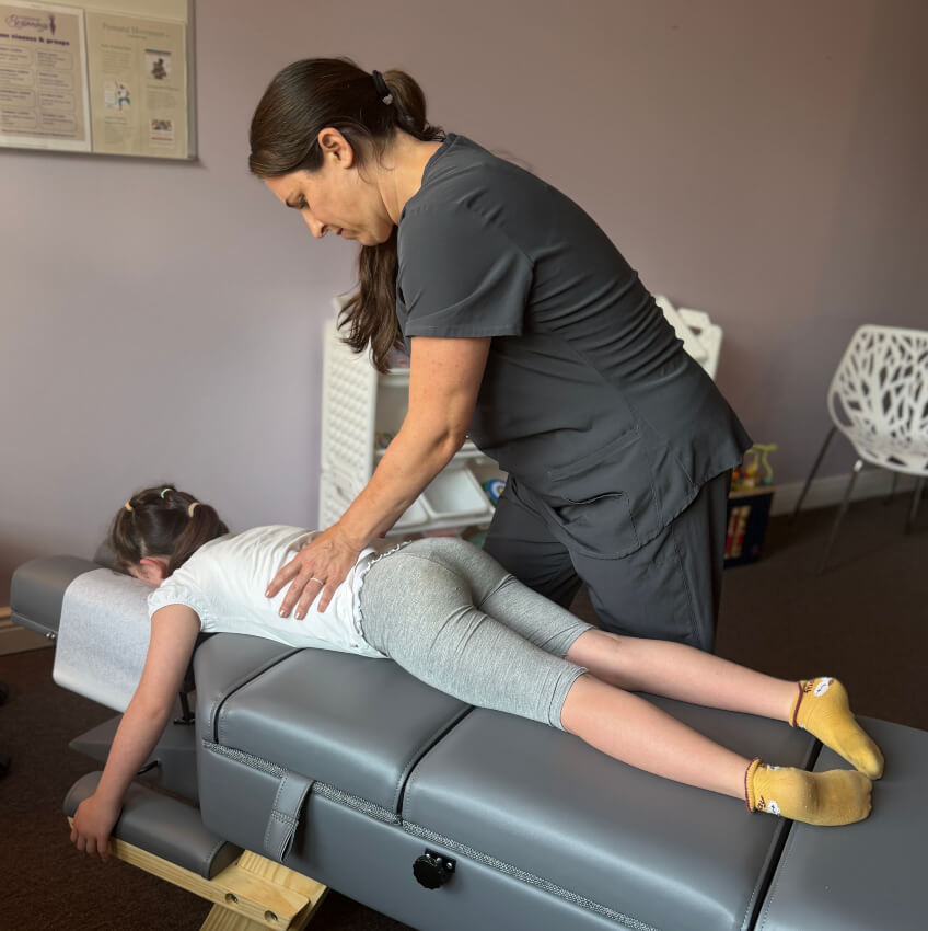 child having back adjusted