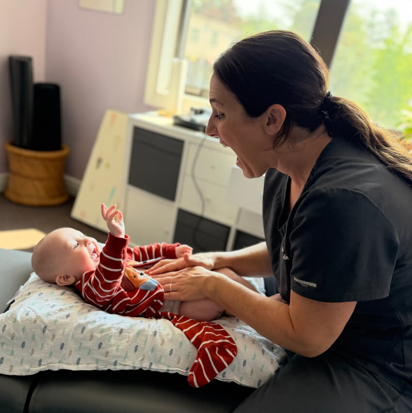 baby smiling at our doctor