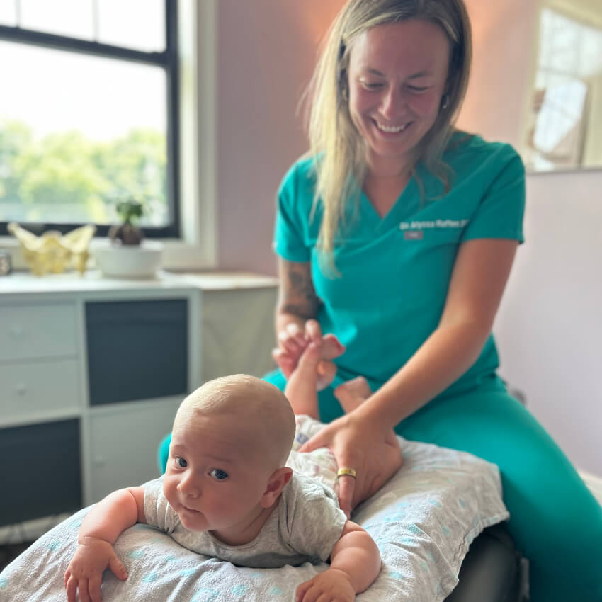 baby having legs adjusted