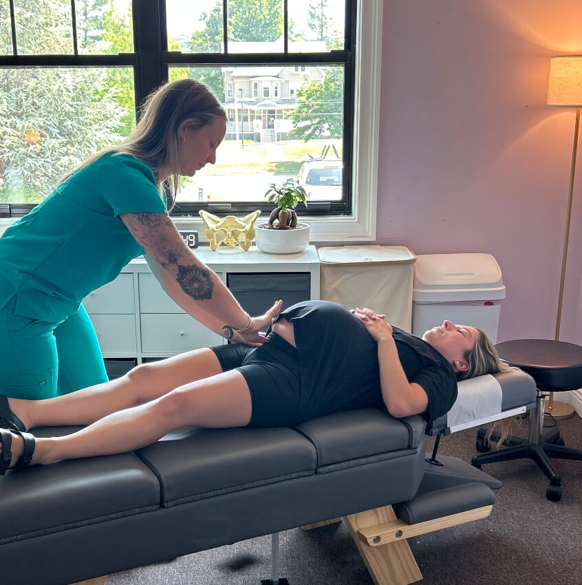pregnant patient having hips adjusted