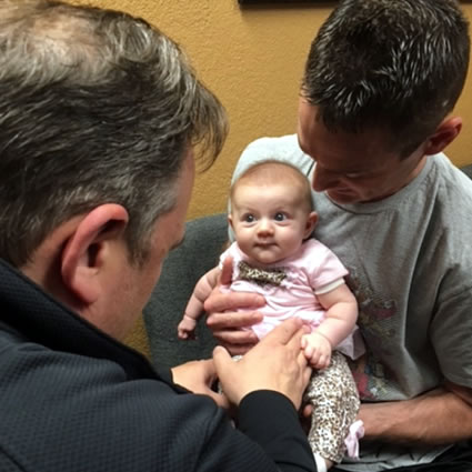 Infant being adjusted