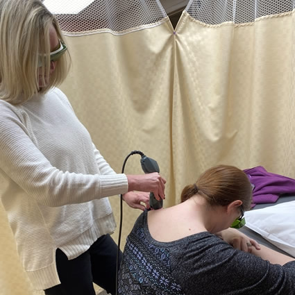 Woman doing laser therapy