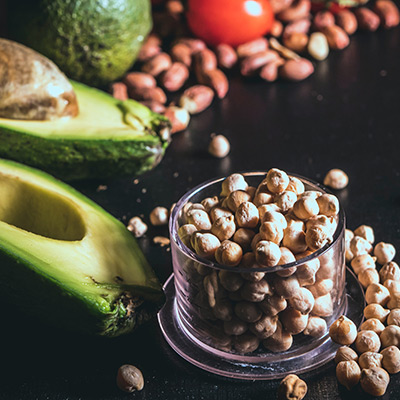 nuts and avocados on a cutting board