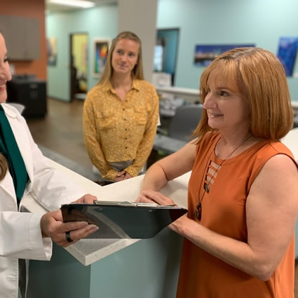 Woman receiving paperwork