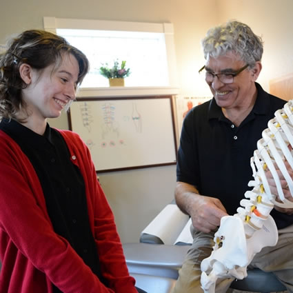 Dr. Keeler with patient in red sweater