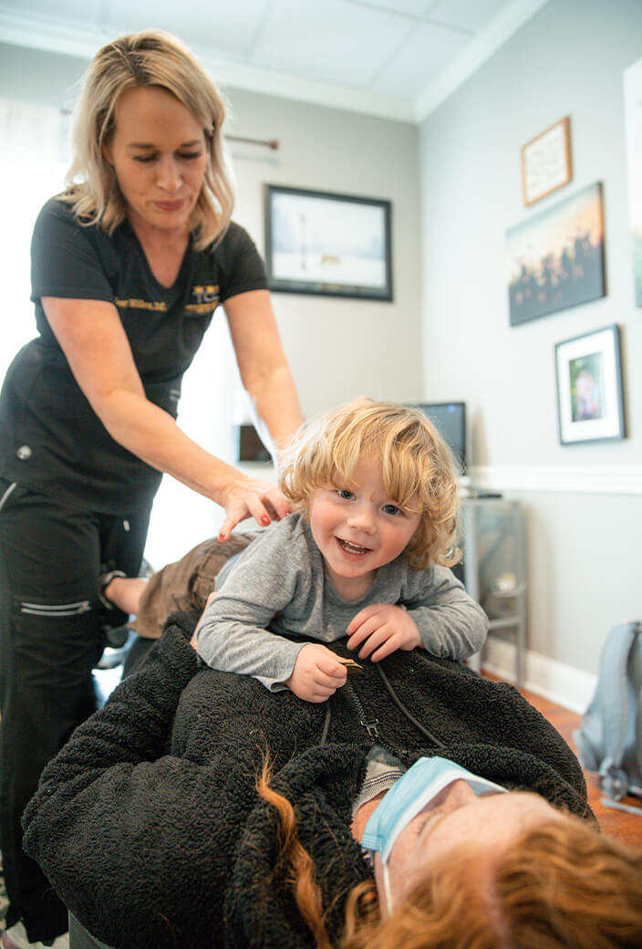 Dr. Jenny adjusting child