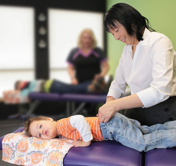 Colorado Springs chiropractor Dr Siow adjusting child