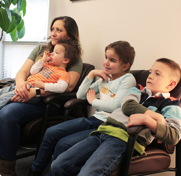 Satori Spinal Wisdom, LLC patient mom and kids in waiting area