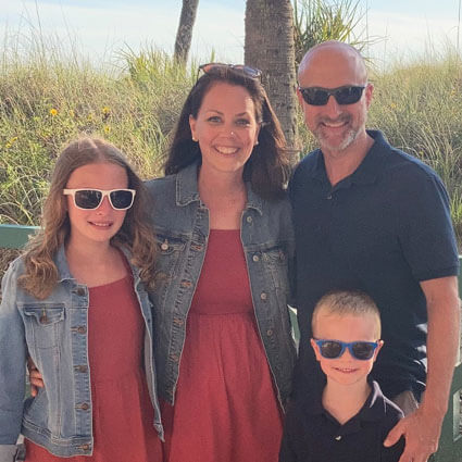 Dr. Eric and his family near beach