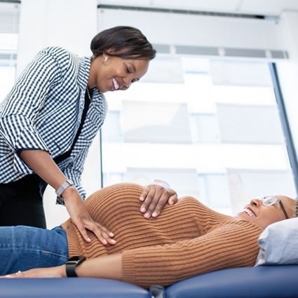 Liliies adjusting pregnant woman