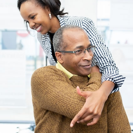 Doctor adjusting patient's shoulder