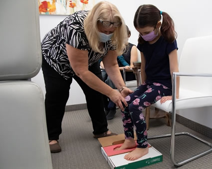 Girl getting orthotics