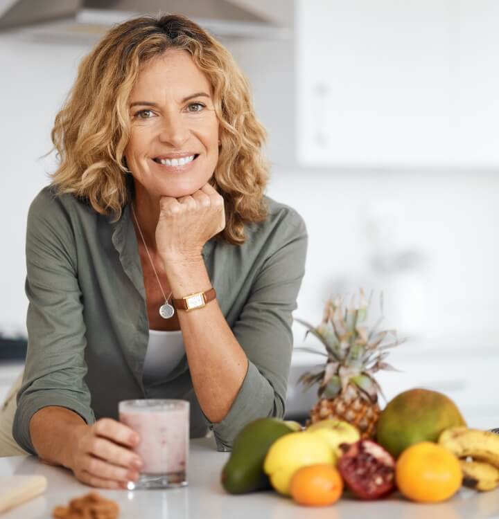 woman holding smoothie