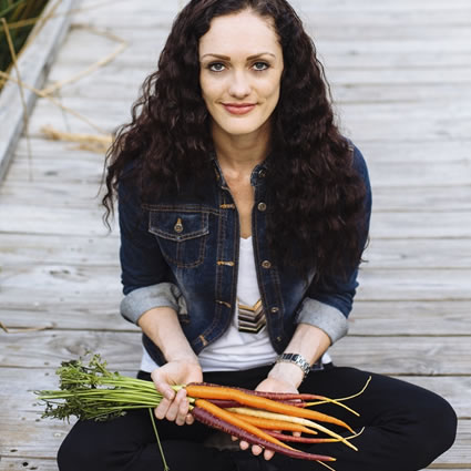 Gabrielle sitting holding carrots