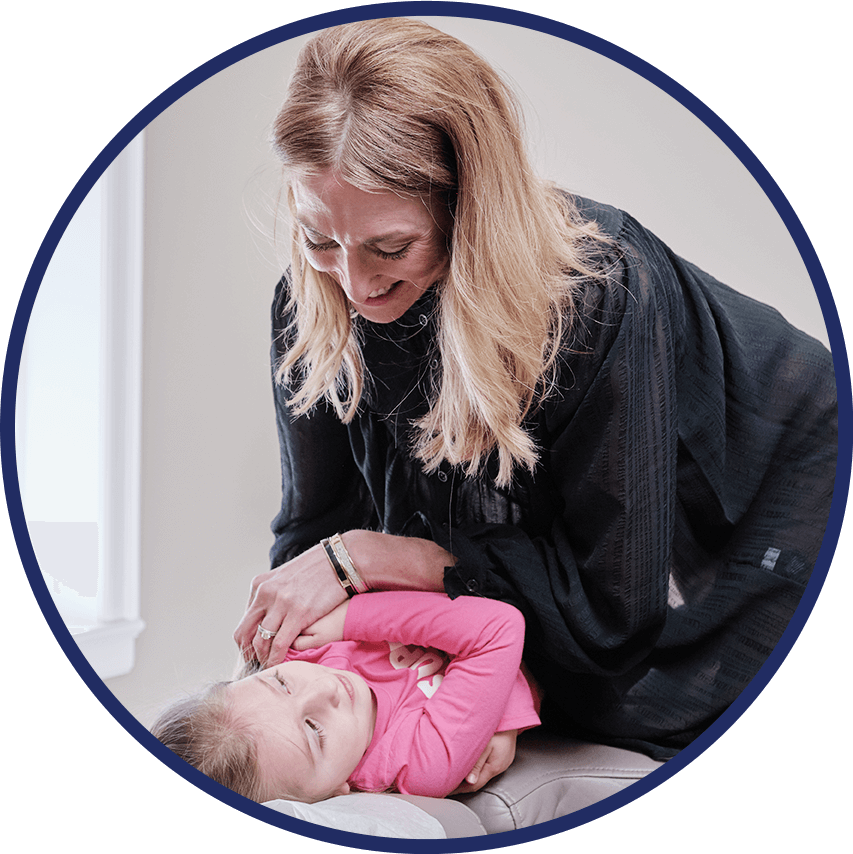 Dr. Jessica adjusting little girl