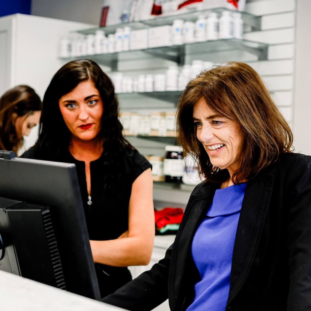 handing paperwork to receptionist
