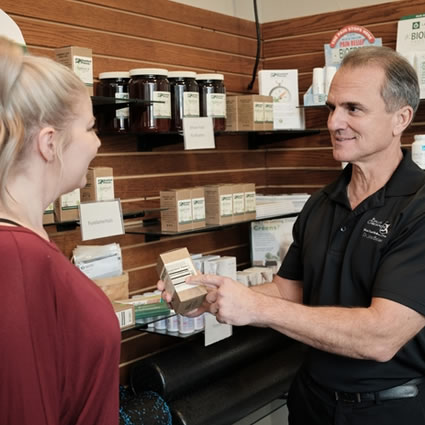 Dr. Charles showing supplements to patient