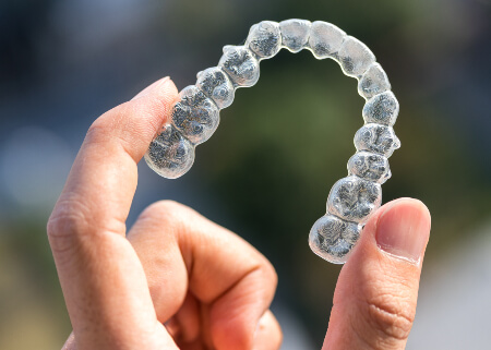 Man holding Clear Aligners