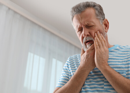 Man with severe dental pain