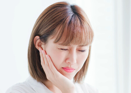 Woman with a severe toothache