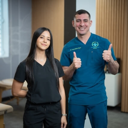 Bayamon chiropractor Dr. Jesus Rolon and Alia posing for photo