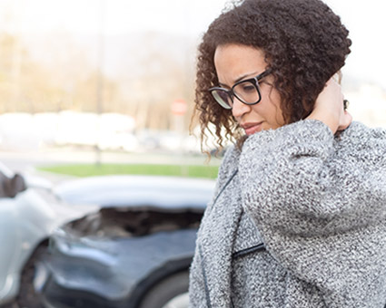 woman with a sore neck after an auto accident