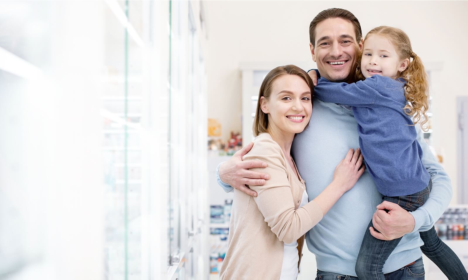 Family of three smiling