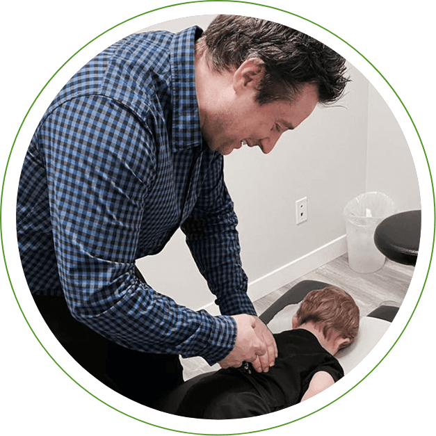 Dr. Matthew adjusting kid patient