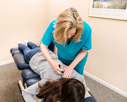 Dr. Lynn using activator on neck