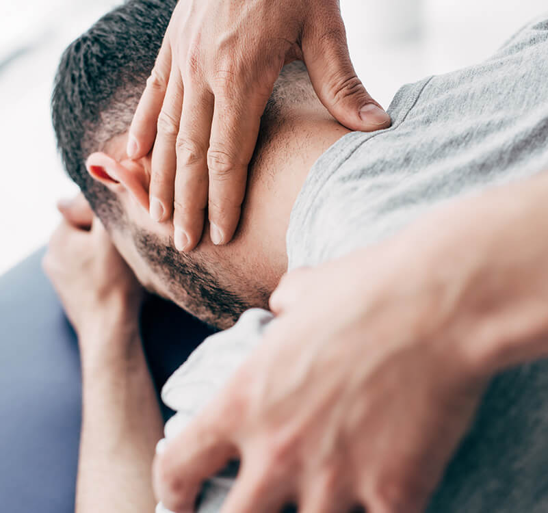 Dr using activator on patients neck